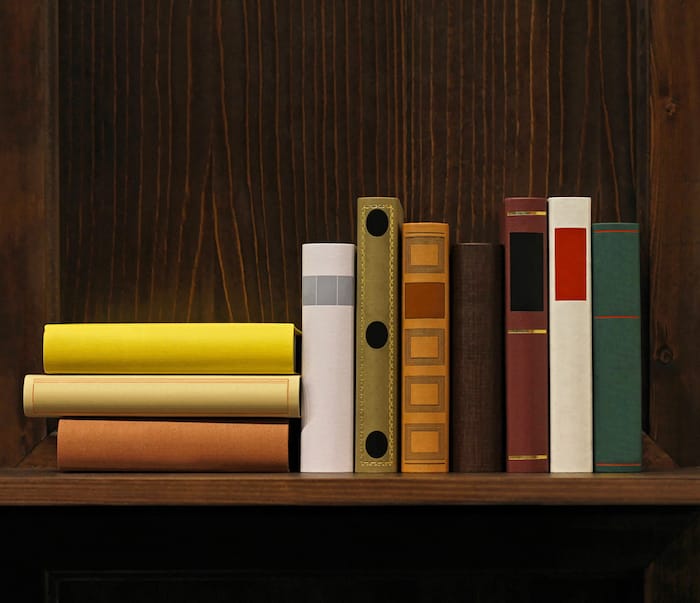 Dark wood book shelf with old books